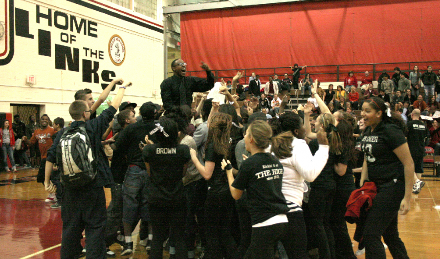 LHS Staff Black Team coach Demarius Lott (12) is raised on the shoulders of extatic fans Friday night, Nov. 11, 2011 after his team wins the Hoops for Hope staff basketball tournament in the Johnson Gym. The event raised money for three charities: Santa Cop, Toys for Tots, and the Friendship Home. 