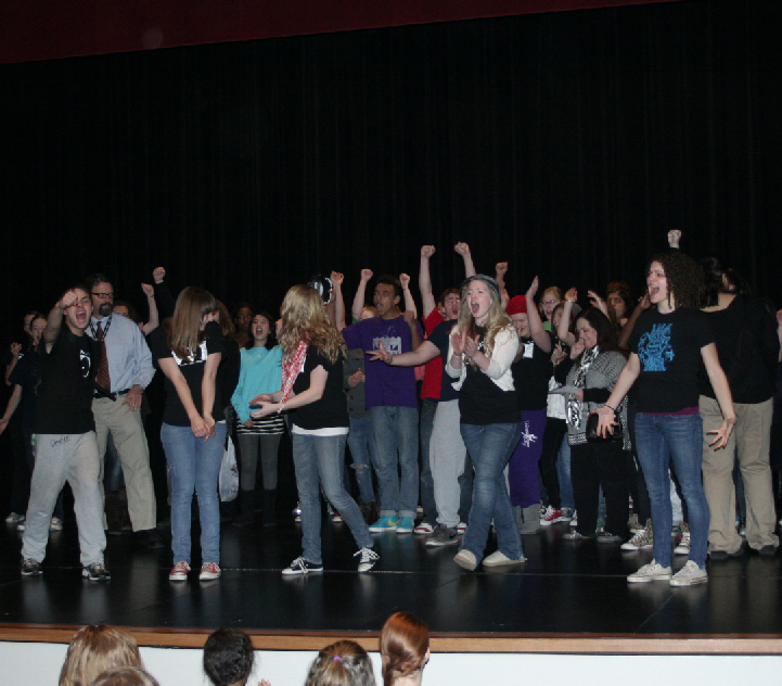 The District Champion cast and crew of the  LHS One Act Play Production get fired up at a school send-off Thursday in the Ted Sorensen Theatre before heading to Kearney, Nebraska for the State Competition. The troup will perform the play, Home on the Mornin Train. 