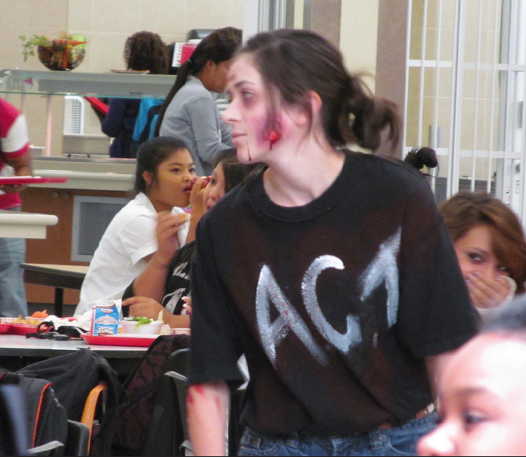 Above: Emma Fisher (11) dresses up as a zombie walking around the lunch room to promote ACT Prep sessions. Photo by Sammi Yelkin