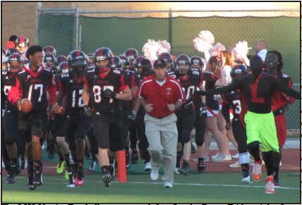 The LHS Varsity Football runs out to defeat Omaha Bryan Friday night, Sept. 20th at Beechner. Photo by Alexis Graewe.