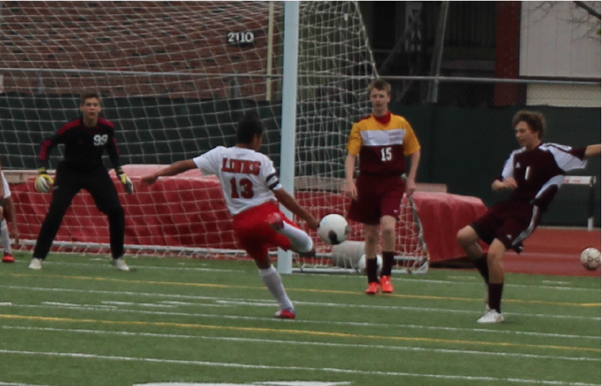 JV Boys Soccer player Fernando Saavedra attacks the Roncalli goal
during a game at LHS on April 18, 2015. The Links defeated Roncalli 8-0
and went on to win the JV City Title. Photo by John Ferreira