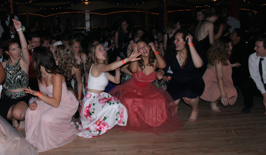 (From left to right) Joanna Hejl (12), Eva Hafermann (11), Saadi Ali (11), and other students, dance at prom on April 16th, 2016, to the Cha Cha Slide by DJ Casper.
Photo by Samantha Stuefer