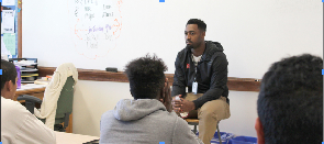 Nebraska Huskers linebacker Michael Rose-Ivey talks with students in Sarah Downs’s English class about peaceful protesting. Photo by Brianna Rodriguez.