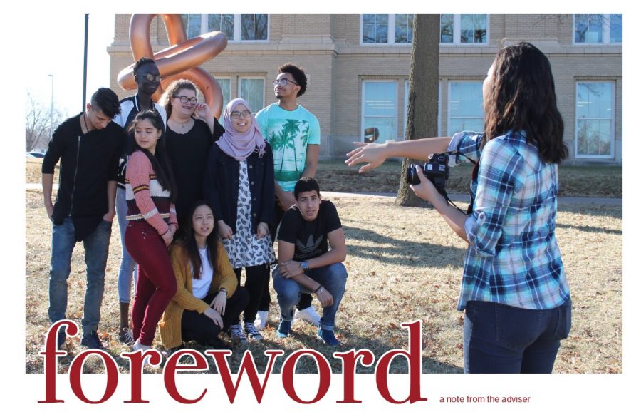 Advocate+photographer+Angel+Tran+sets+up+students+posing+for+the+cover+photo.+
