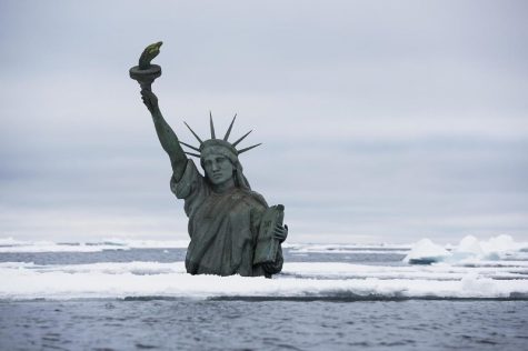 A semi submerged Statue of Liberty in the Arctic Ocean draws attention to the effects of climate change on rising sea levels, as world leaders are about to gather in New York for the Climate Summit hosted by UN Secretary-General Ban Ki-moon. The melting of Arctic glaciers and ice sheets contributes directly to global sea level rise. The photo was taken in the Arctic Ocean northwest of Svalbard the 7th of September 2014.
