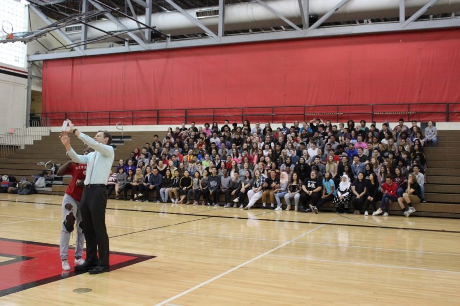 LHS Principal Mark Larson takes a selfie with the graduating class of 2017 during the group senior photo in the Johnson Gym on Thursday, May 18, 2017. Photo by Angel Tran