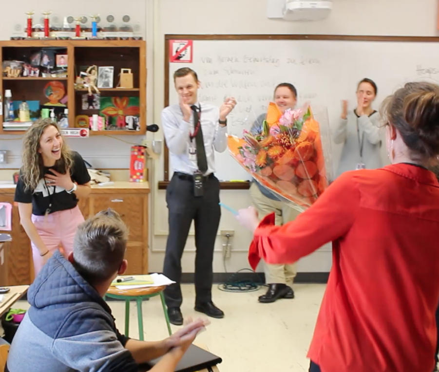 German teacher Marissa Wanamaker gets a surprise during her 6th period class on Thursday, Oct. 26, 2017 as World Languages Department Chair Janet Eckerson presents her with the Outstanding German Teacher of the Year Award from the Nebraska Association of Teachers of German.