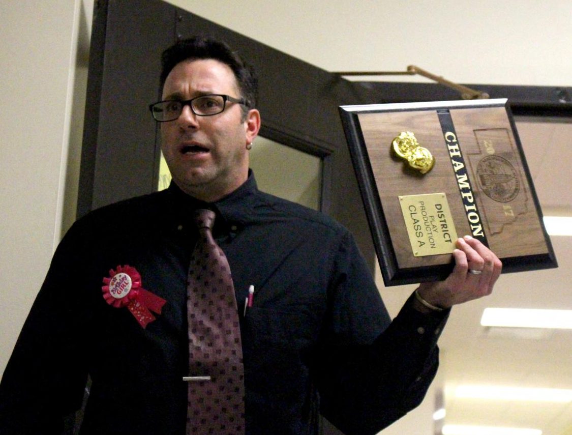 Theatre director Justin Holbein speaks to the cast and crew of the Play Production One-Act Team after their first place victory at districts. Photo by Carson Allen
