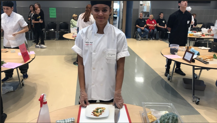Sophomore Ariana Larson- Pool shows her finished product at the Culinary competition on November 15, 2017. Photo Courtesy of Lovena Glantz 