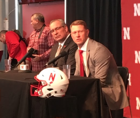 New Husker Football Coach Scott Frost sits at the podium on Sundays press conference, December 3rd, with Athletic Director Bill Moos to his left. Photo courtesy of Shane Gilster.