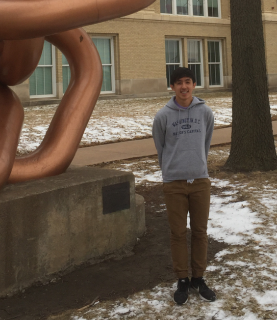 Daniel Do poses outside of LHS by the Links statue. Photo by Jacob Vanderford