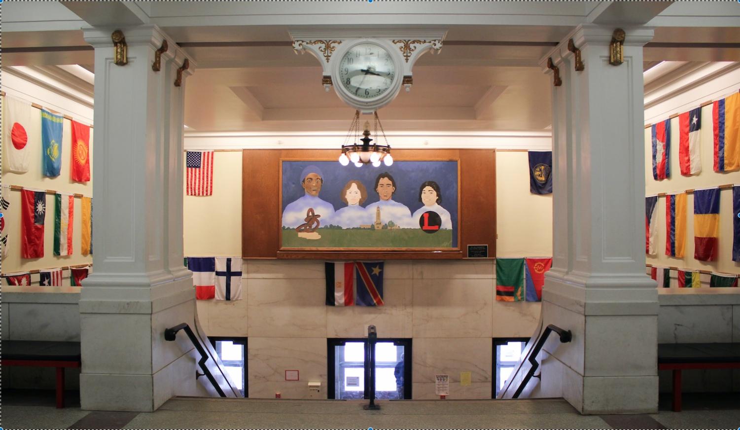 The entrance of Lincoln High School features flags and a mural that represent the school's diversity. Photo by Sara Balter.