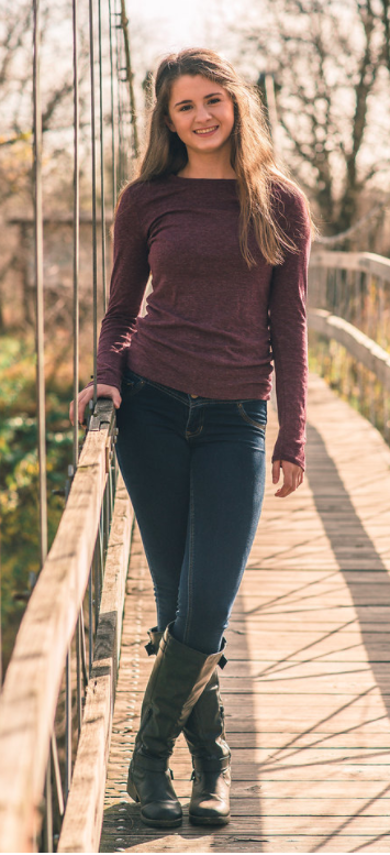 Grace Miller poses on a bridge in Pioneers Park. Photo courtesy of Kelly MItchell 
