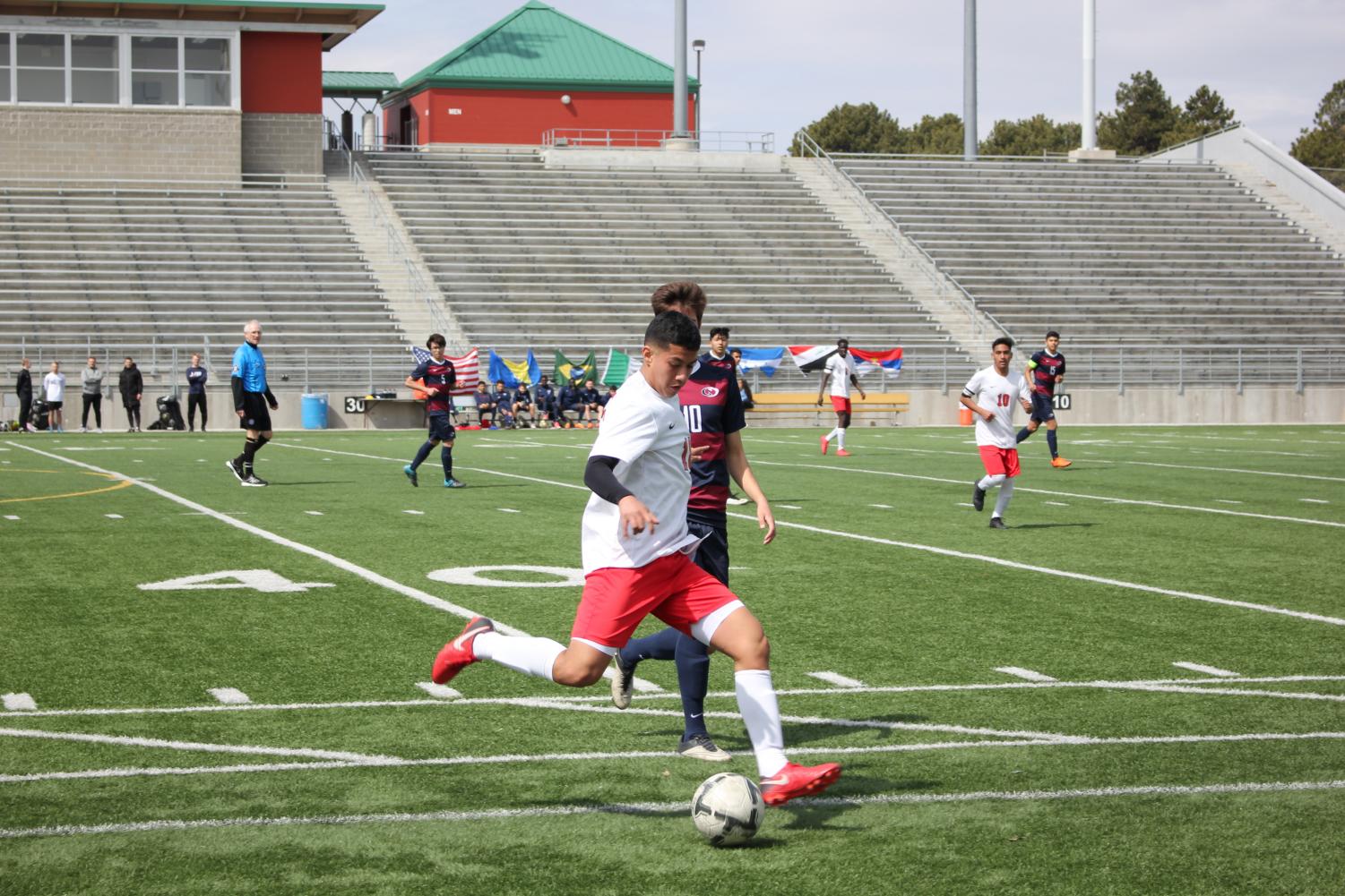 File Photo: #18 Junior Chris Izaguirre saves the ball from going out of bounds during a game against Lincoln North Star on March 30th, 2018 at Seacrest Field. Photo by Eli Fisher