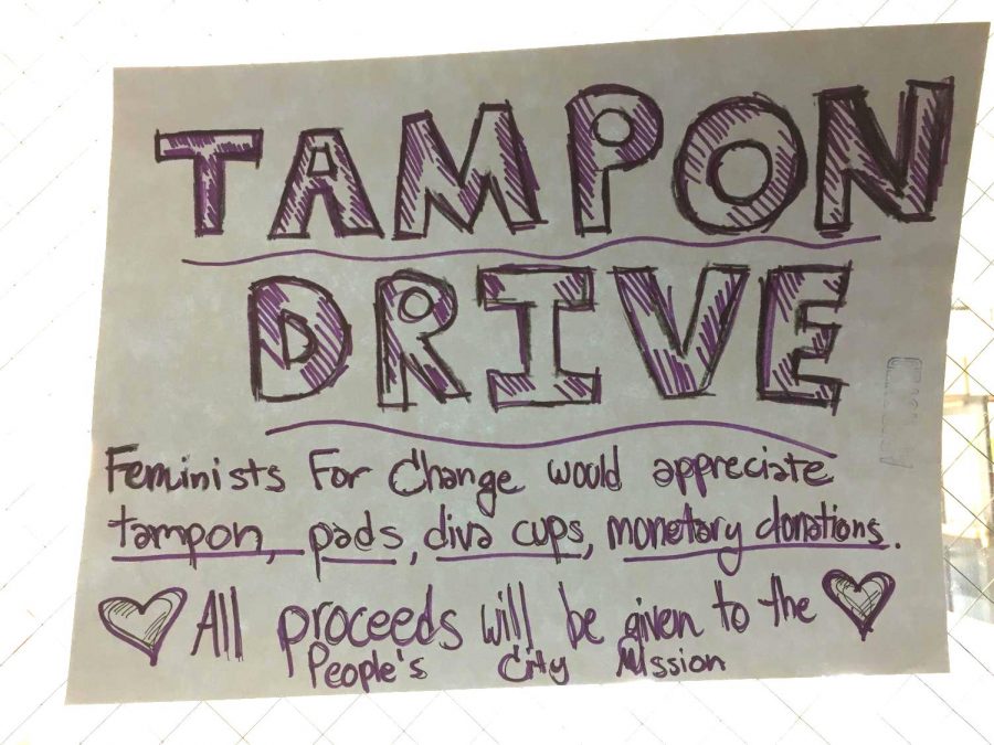 One of many posters from around the building giving information about the Tampon Drive. Advocate file photo. 
