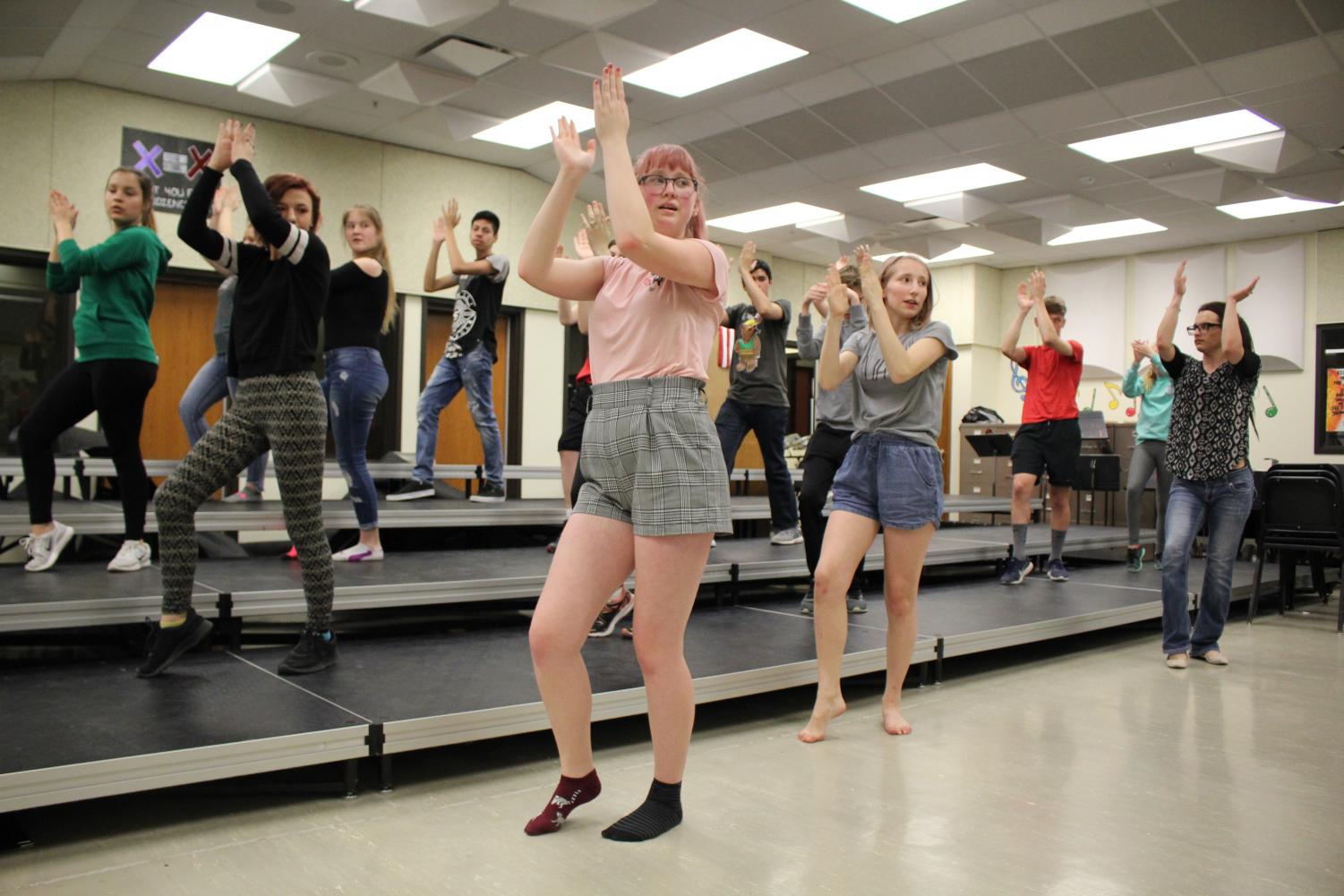 Emily Price (11) and Reagan Gordon (9) help lead the show choir dance workshop through the week of April 23. Photo by Audrey Perry
