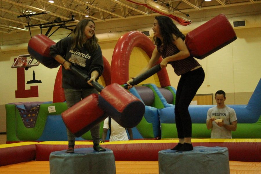 Students Cameryn Bratcher-Rosekrans (10) and Maria Garcia Castorena compete in the Joust Tournament at last years Festivus. Food and activities are back for this years celebration on Friday, Sept. 14, 2018. Photo by Maria Izaguirre