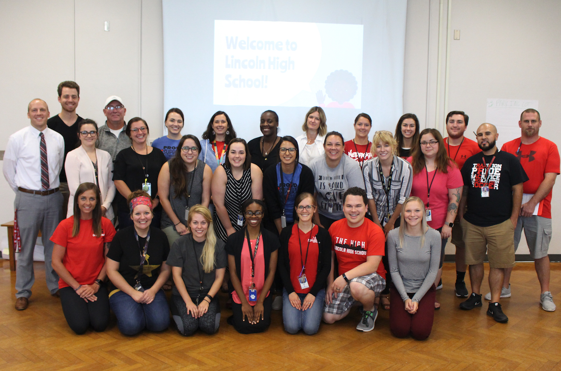 New teachers and staff pose for a photo during a training before the new school year.
FRONT ROW (Left to Right): Candace Robertson (PE); Shelbi Bretz (English); Audrey Augustine (Math); Mar'Lakuittia Overstreet (ELL); Kami Lee (Art); Zach Mapes (WL/Math); Kendra Alberts (SPED)
CENTER ROW (Left to Right): Jon Davidson (Admin); Rachel Scheet (Science); Lindsey Coit (Science); Holly Stejskal (English); April Blackledge (SPED); Brenda Lopez Adame (WL); Carissa Stock (SPED); Lydia Cotton (FACS); Kayla Munoz (WL); Adan Martinez (Counseling)
BACK ROW (Left to Right): Jordan Pullen (WL); Michael Powell (SPED); Nicole Ellison (English); Carol Flora (SS); Dominique Kelley (English); Kirsten Huddleston (SS); Shannon Gusso (SPED); Courtney Fasbender (Math); Joe Cortese (PE); Kevin Prai (STS)