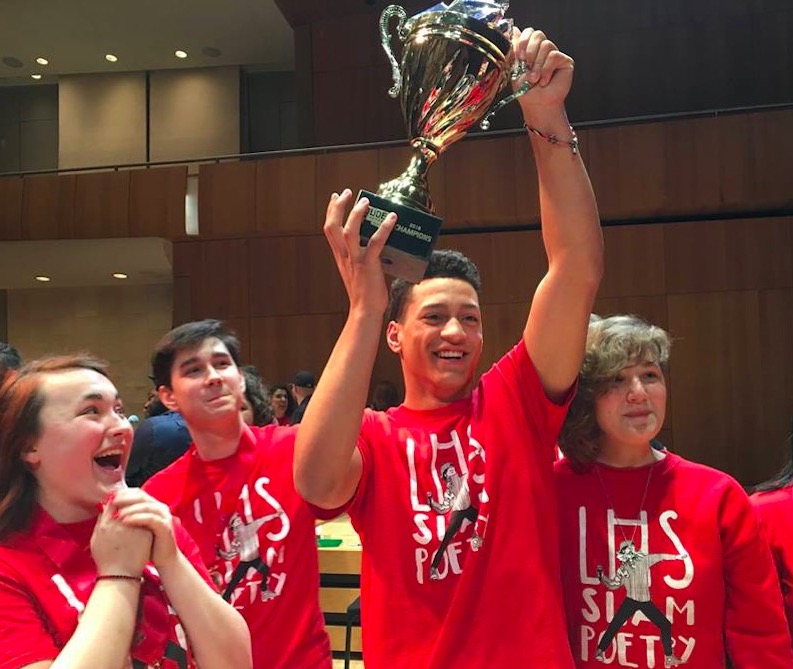 Left to Right: Samantha Robyler, Anthony Delaney, Jack Buchanan, and Karina Hinkley celebrate their state championship win at the Louder Than a Bomb Great Plains slam poetry competition on Tuesday, April 24, 2018 at the Holland Performing Arts Center in Omaha. Photo courtesy of Deborah McGinn
