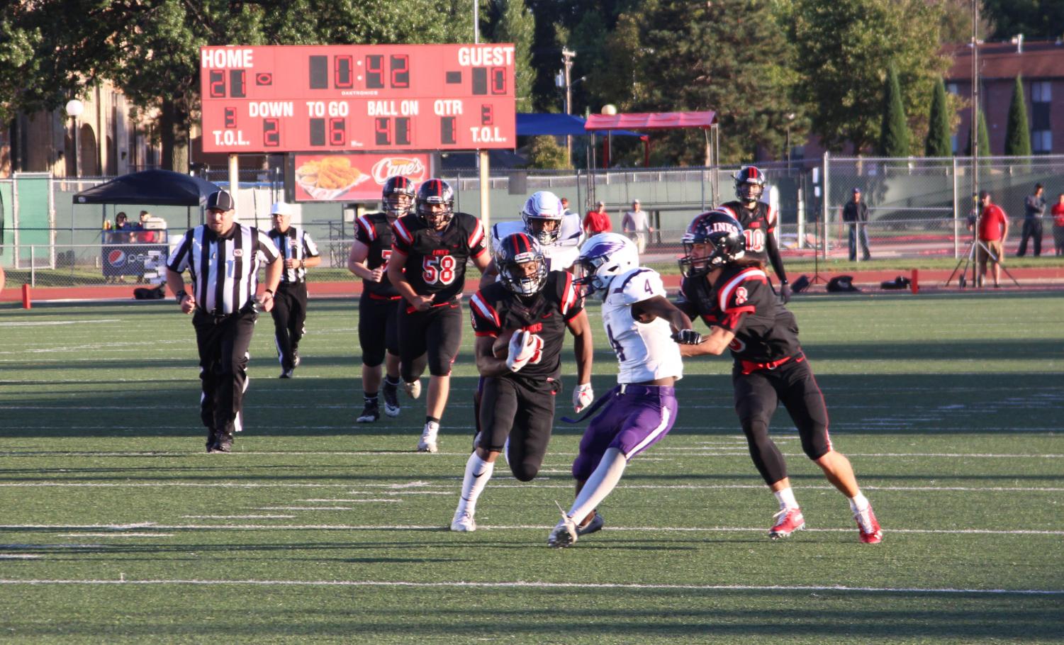 #3 Isaiah Alford runs the ball during the game against Omaha Central at Beechner Athletic Complex on Friday, September 21st, 2018. Photo by Zeke Williams