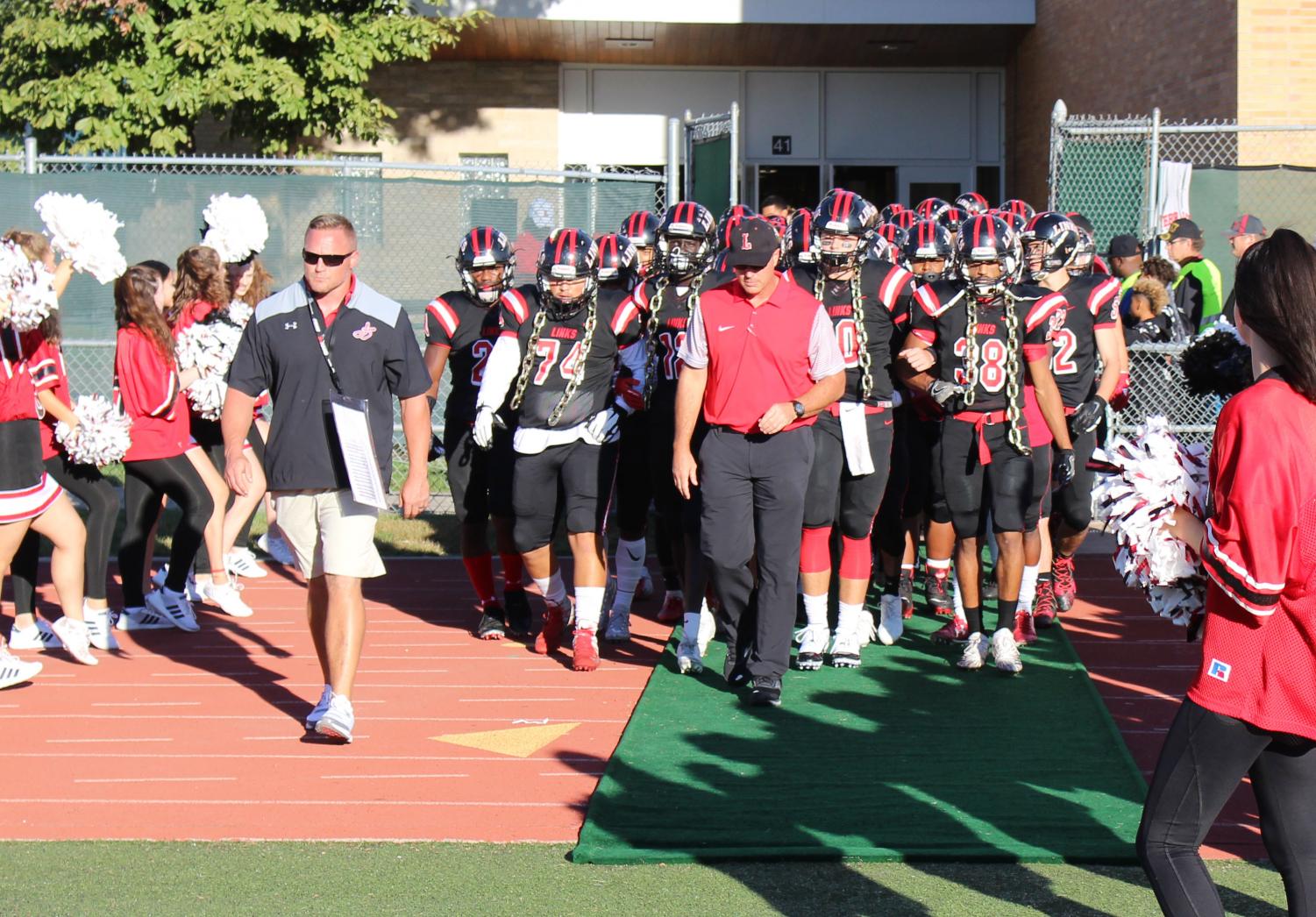 Head Football Coach, Mark Macke, Offensive Coordinator, Chad Case, Senior Captains, Draven Long, Reat Choul, Cedric Case, and Marcel Austin lead the team tunnel walk before the Homecoming Game at Beechner Athletic Complex on Friday, September 21st, 2018. Photo by Anthony Torres