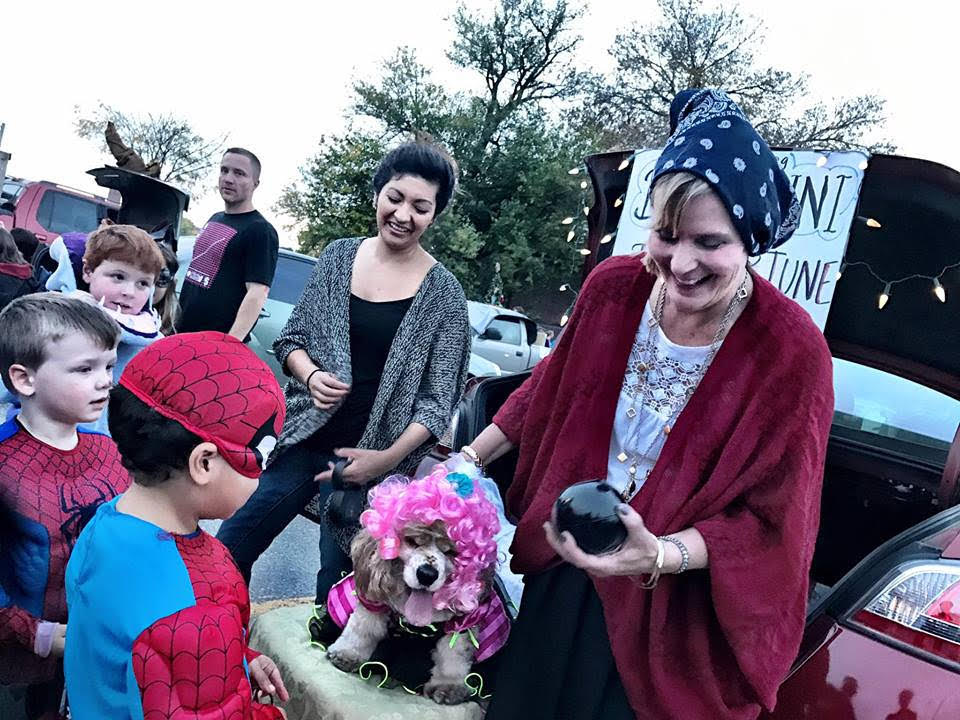 LHS counselor and Key Club sponsor Judy Tuttle gives out candy to a child dressed as Spiderman at the 2017 Trunk or Treat. Advocate File Photo