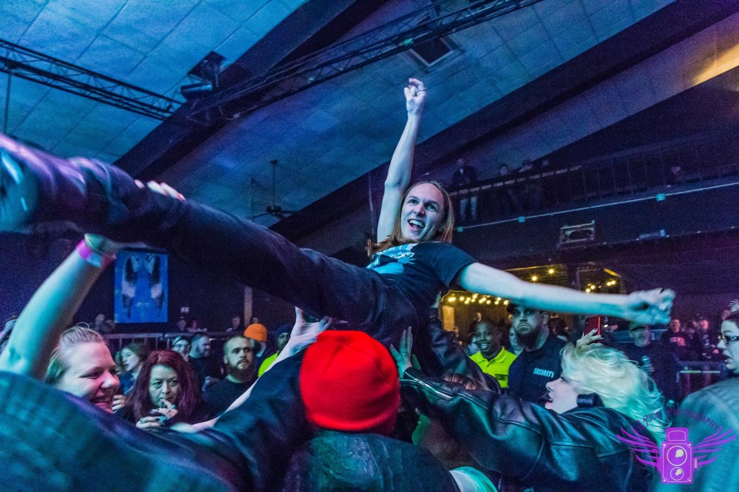Lincoln High musician Will Gades (12) gets a little wild, as well as very trusting, during one of his shows and surfs the crowd of an overflowing venue. This is a regular occurrence for his shows.