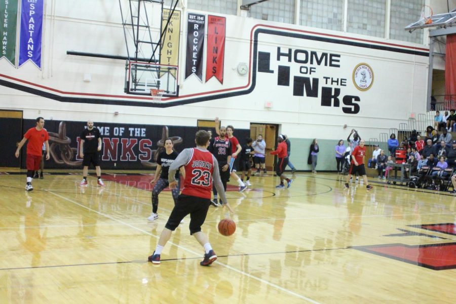 Principal Mark Larson takes the ball down the court during Hoops For Hope on Thursday November 1st, 2018. The Black team won 54-49. Photo by Zeke Williams