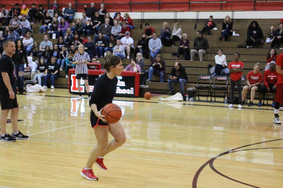 Social Studies Teacher Lindsey Half Court Herting makes a late entrance in the fourth quarter of Hoops for Hope on November 1st, 2018. Photo by Zeke Williams