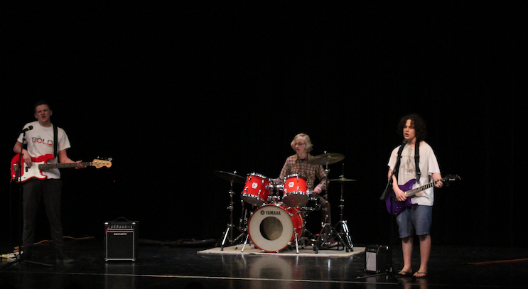 The rock band Smells Like Bold preforms at Joy Night 2018 on May 11, 2018. Ethan Rask (10), Vincent Welsh (10) and Emerson Borakove (10) are the preforming members. Photo by Livia Holbert
