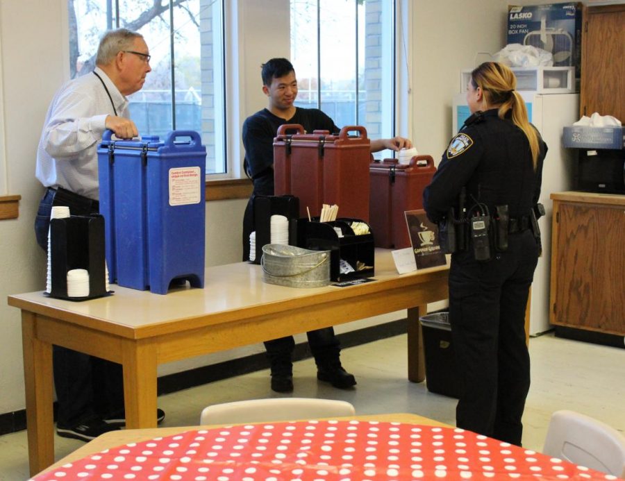 Correctional Officer Megan Nelson stops by Common Grounds for a cup of coffee on a Friday morning.  Senior Hieu Ngo is happy to serve. Photo by Audrey Perry