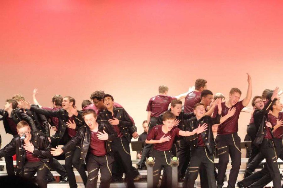 The men of Momentum, Lincoln Highs varsity show choir, perform Believer by Imagine Dragons at the Red Carpet Classic Competition at Elkhorn High School in Elkhorn, Nebraska on Saturday February 2nd, 2019. This was Momentums first competition of the season. Photo Courtesy of Matt Olberding
