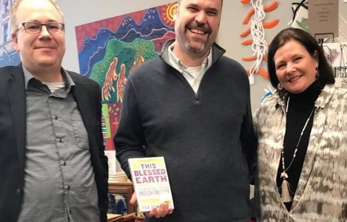 Author Ted Genoways (center) publisher David Mallman (left) and owner of Francie and Finch Bookshop Leslie Huerta (right) at Genoways book signing on January 12, 2019. His book, This Blessed Earth: A Year in the Life of an American Family Farm, was chosen for the 2019 One Book One Nebraska reading program. Photo courtesy of Francie and Finch Bookshop.
