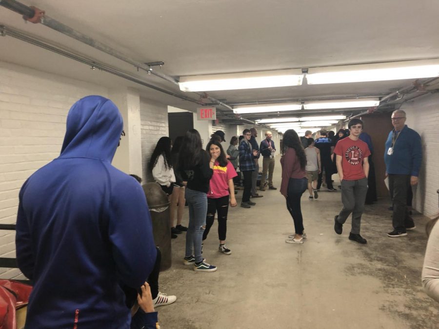 Students and Staff crowd the LHS Basement during the Shelter drill on March, 27th, 2019. The Tornado siren went off at 10:15, effectively halting all fourth period classes. Photo by Emily Price
