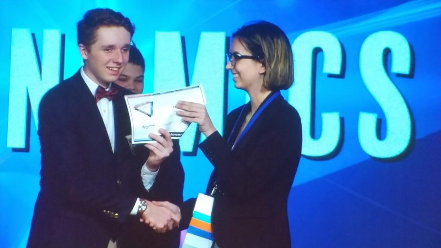Senior Chloe Andreini receives a honorable mention certificate during the FBLA State Leadership Conference Awards Ceremony on April 16th, 2019.  Andreini received her certificate in Economics and will compete at nationals in June in San Antonio, Texas.  Photo courtesy of Bonnie Anderson