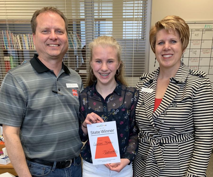 Lauren Moon (10), poses with her award from Googles Science Fair along with her mother Deanne Caspers-Moon, and her father Rich Moon in the LHS Counseling Center on April 5th, 2019. Her parents surprised her at with the award at school. Photo courtesy of Niki Barnes