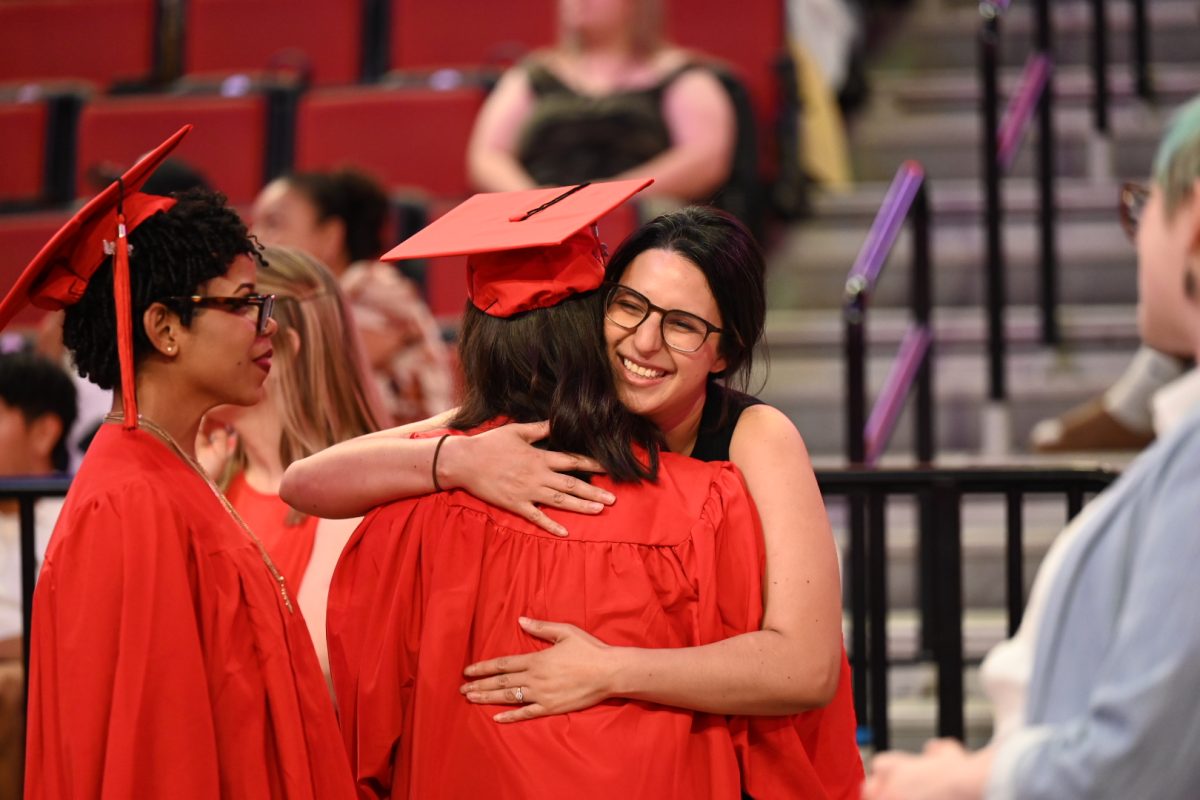 Spanish Teacher Brenda Lopez-Adame congratulates one of her seniors on graduating at the 2024 Commencement.