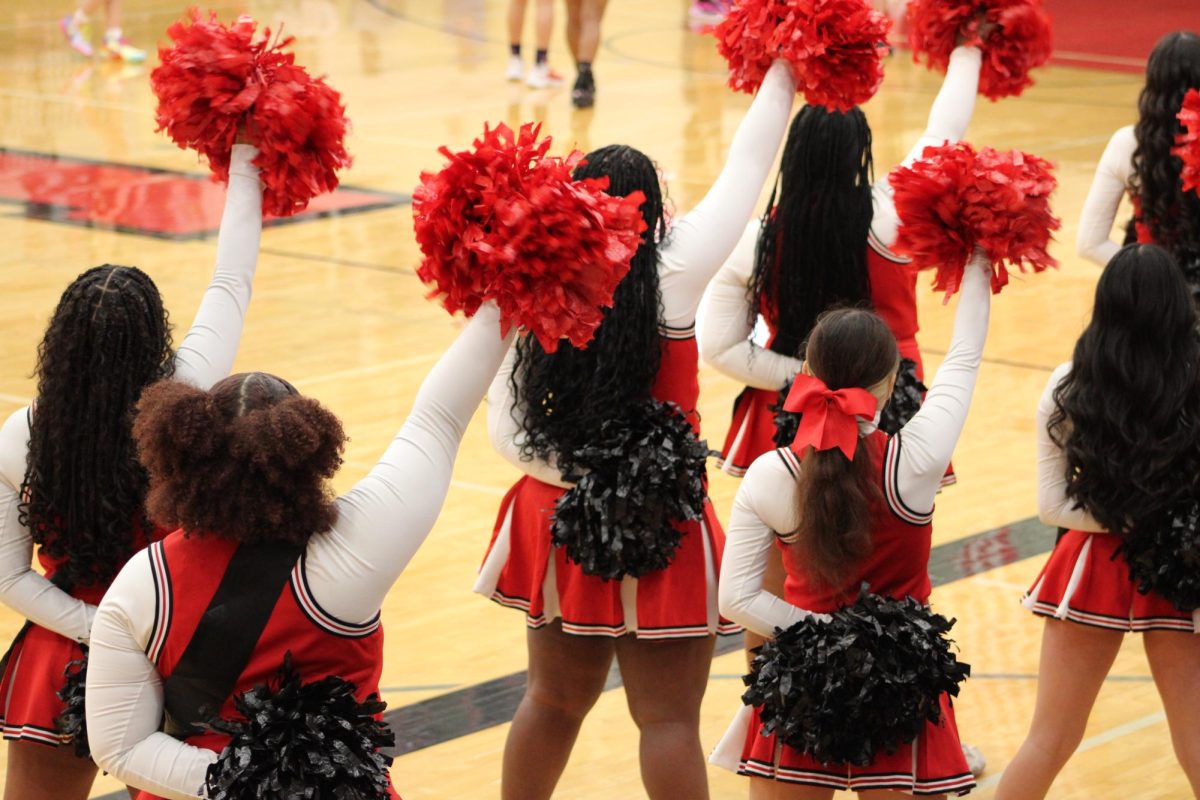 LHS' cheer team performing on their senior night.