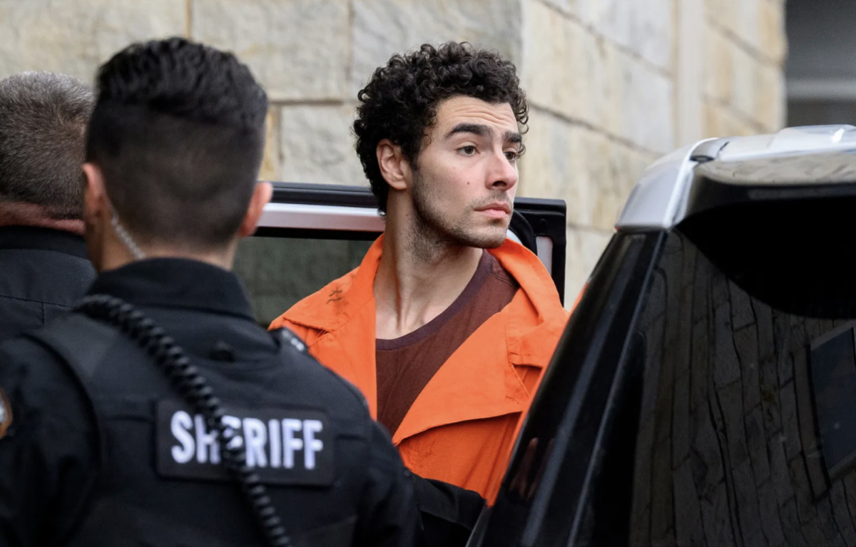 Suspected shooter Luigi Mangione is led into the Blair County Courthouse for an extradition hearing on December 10, 2024 in Hollidaysburg, Pennsylvania.