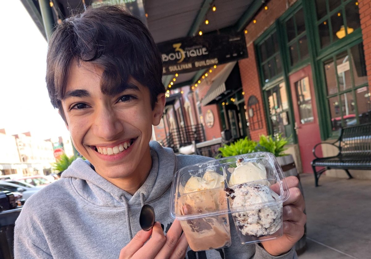 Alex DeHeer samples four different types of ice cream at The Waffle Cone; owned by Scoops: