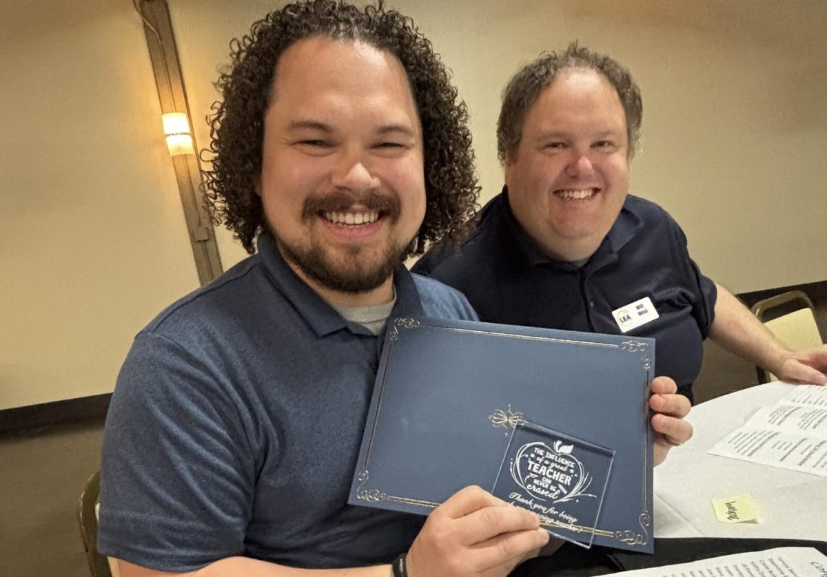 Award-wining Spanish teacher Zach Mapes (left) and award nominator Will West (right) at the LEA awards event Thursday. (Photo curtsey of Elie Mapes)