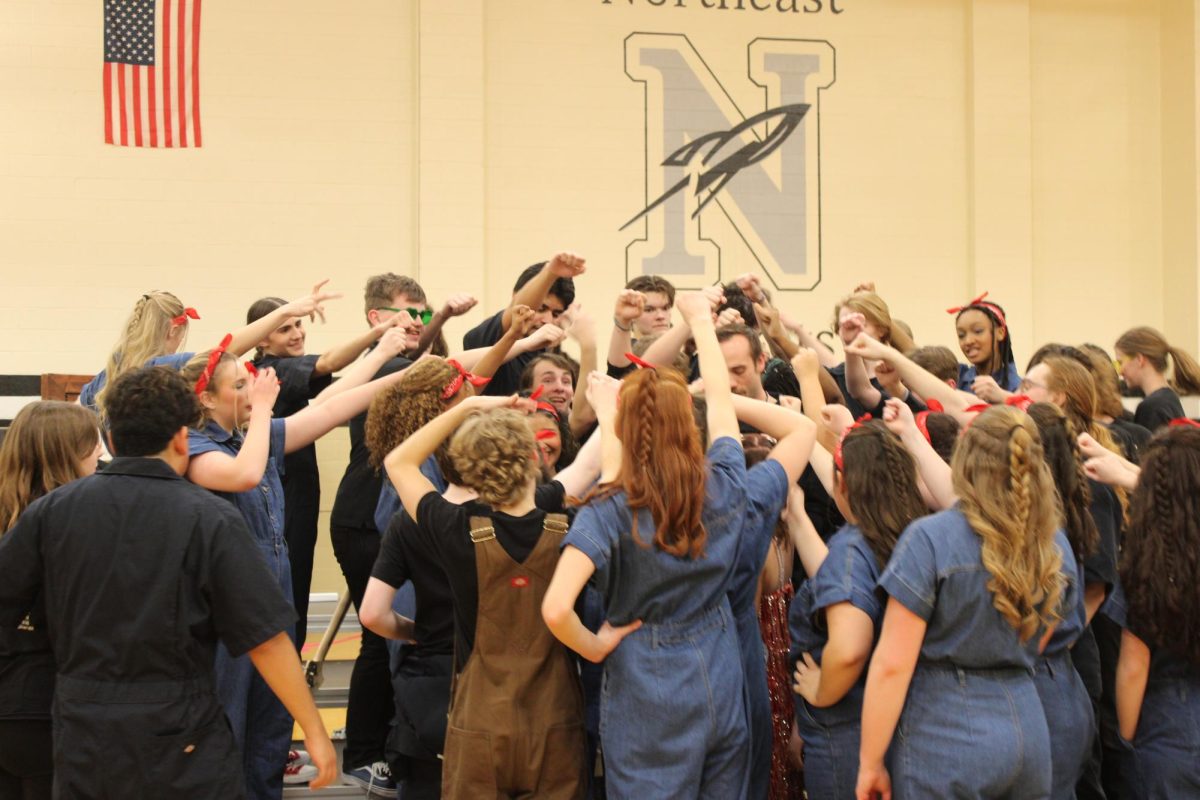 LHS's varsity show choir group, Chain Reaction, preparing for their final competitive performance.